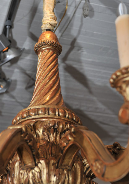 Elegantly carved eight light giltwood chandelier