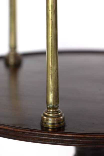 Ring turned brass supports of a Regency Brass-Mounted Mahogany Three Tier Dumb Waiter, Early 19th Century.