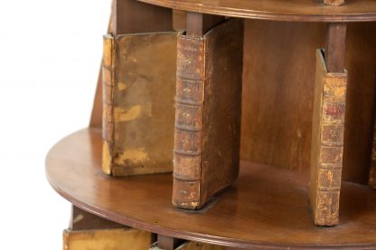 Four Tiered Edwardian Mahogany And Leather Revolving Bookcase With Faux Book Dividers, English Circa 1900.