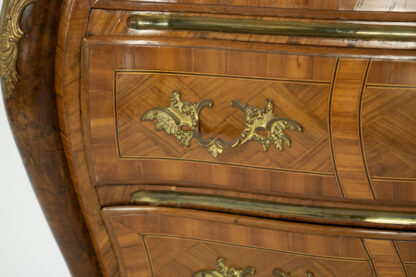 Ornate pull on an A Swedish Rococo Bombé Commode, Mid 18th Century.