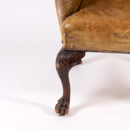 Large Scale English Ochre Leather Wing Chair With Button Tufted Back, Circa 1900