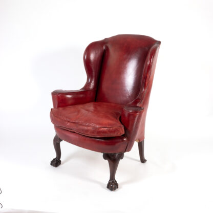 Ox Blood Red Leather Wing Chair with Loose Seat, English Circa 1900.