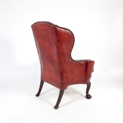 Ox Blood Red Leather Wing Chair with Loose Seat, English Circa 1900.