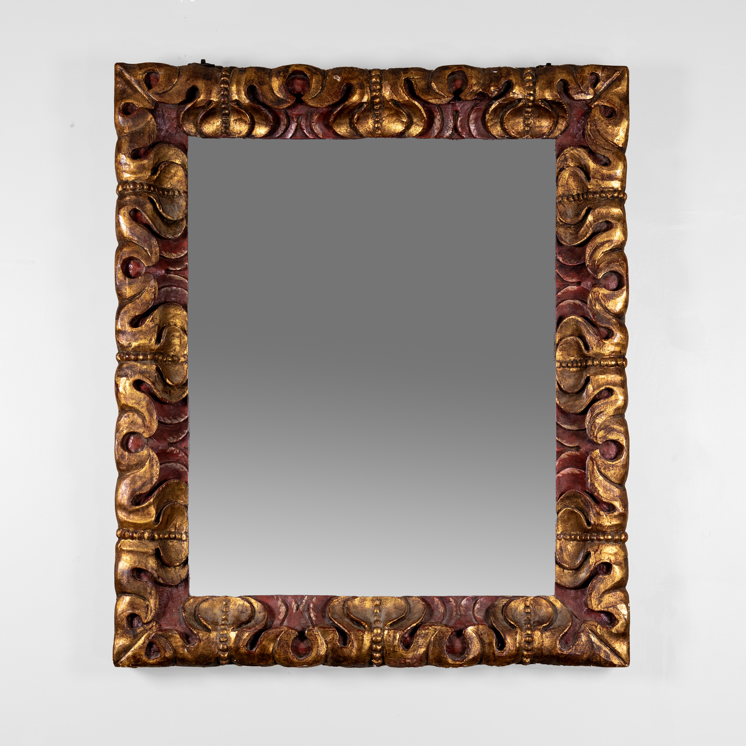 Deeply Carved Giltwood and Red Painted Mirror Frame with Original Mercury Plate, Spain Circa 1900