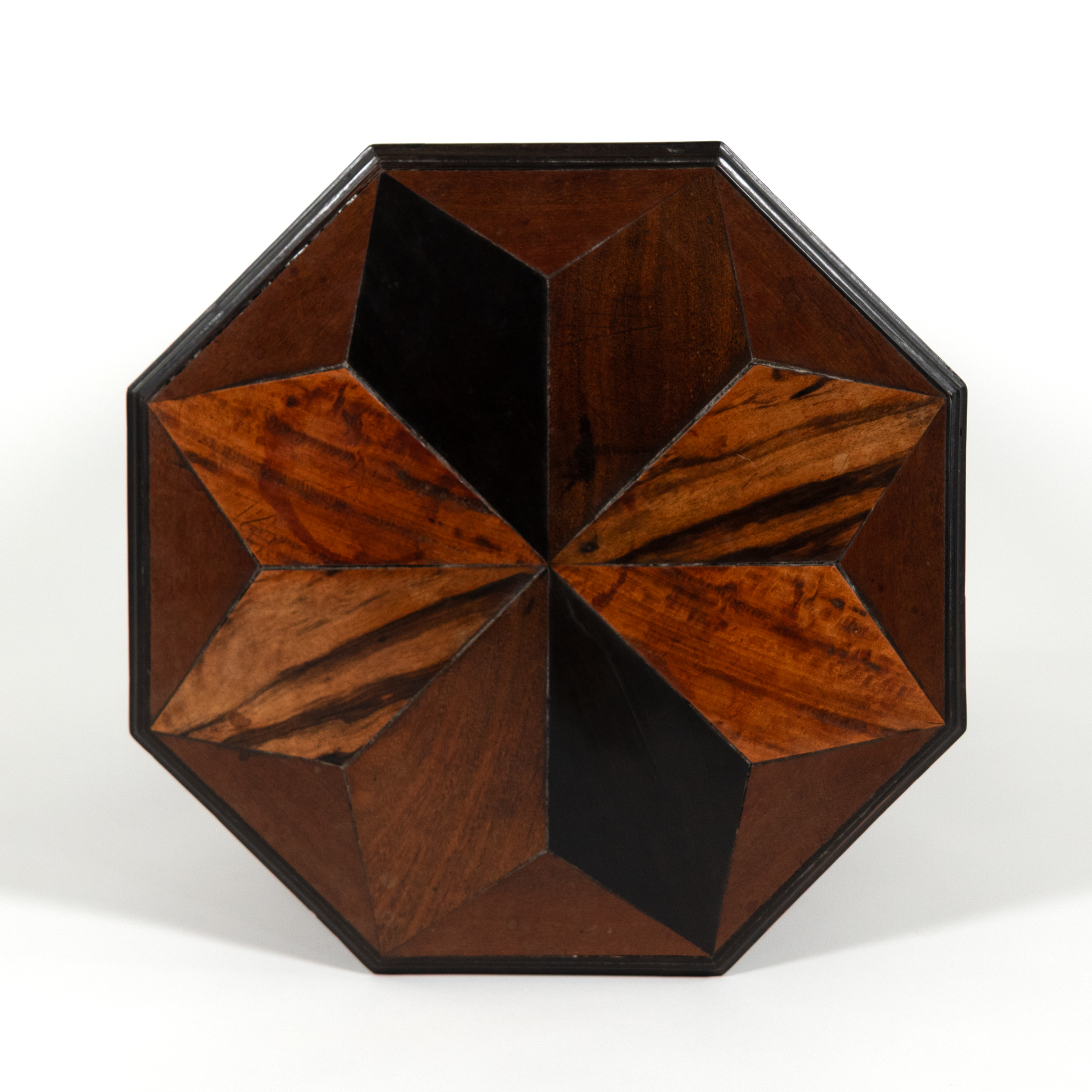 Octagonal star inlay detail showing ebony, satinwood, and teak segments on Anglo Indian table