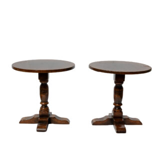 Pair of low round oak cocktail tables with turned column supports, English circa 1920