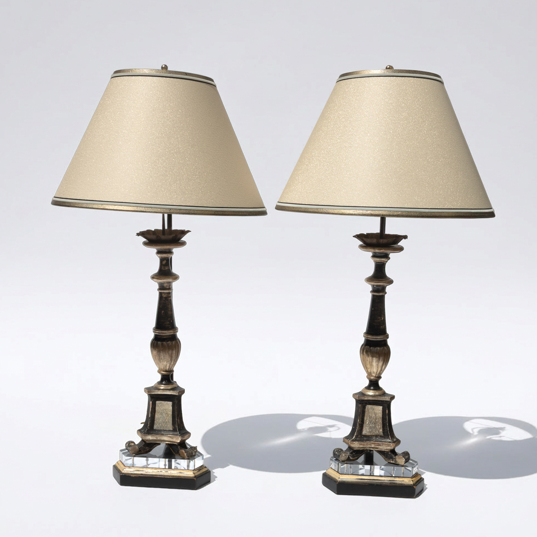 Pair of antique Italian black and silver-gilt lamps with clear acrylic bases.