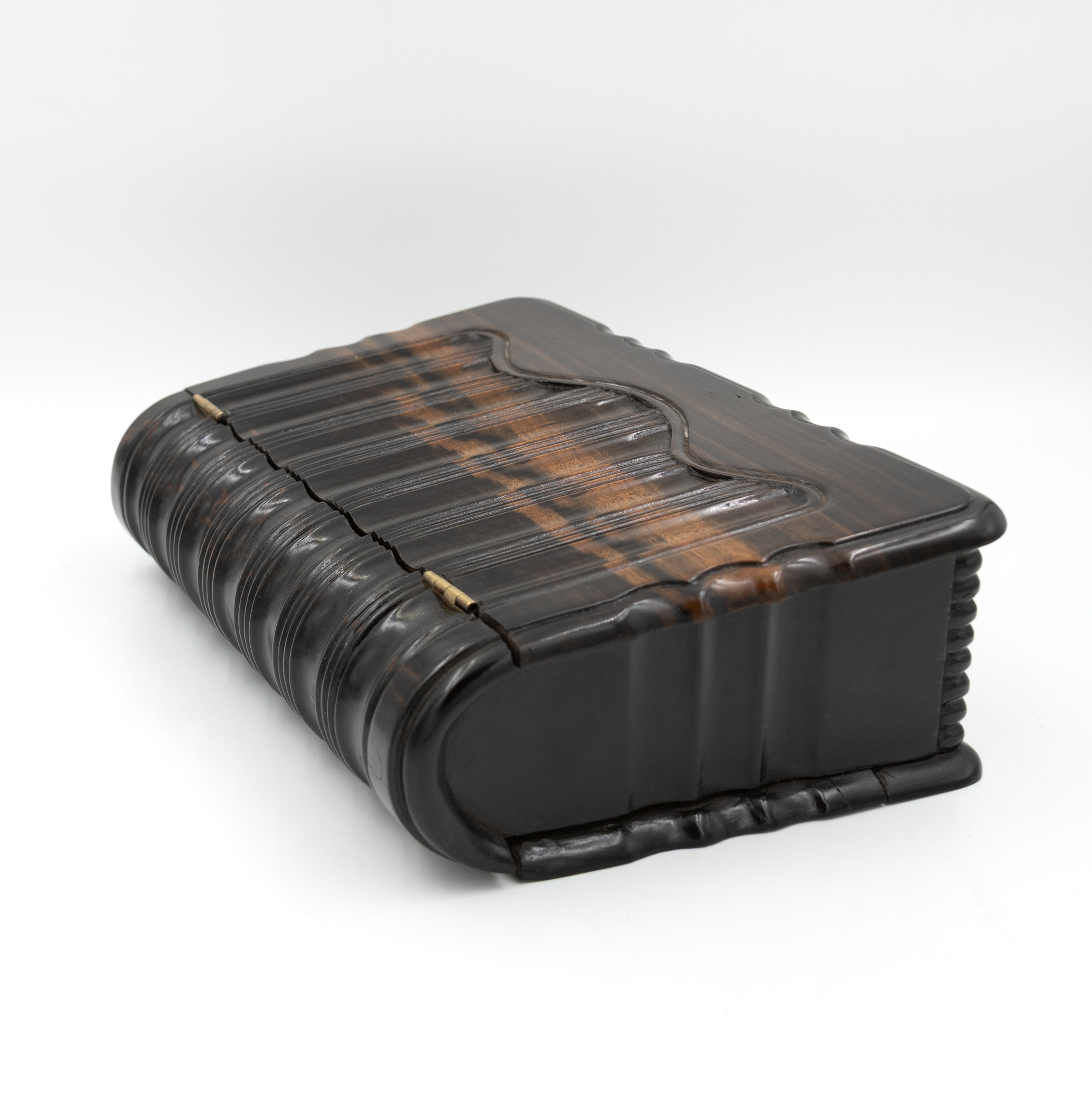 High angle view of antique wooden box shaped like a book