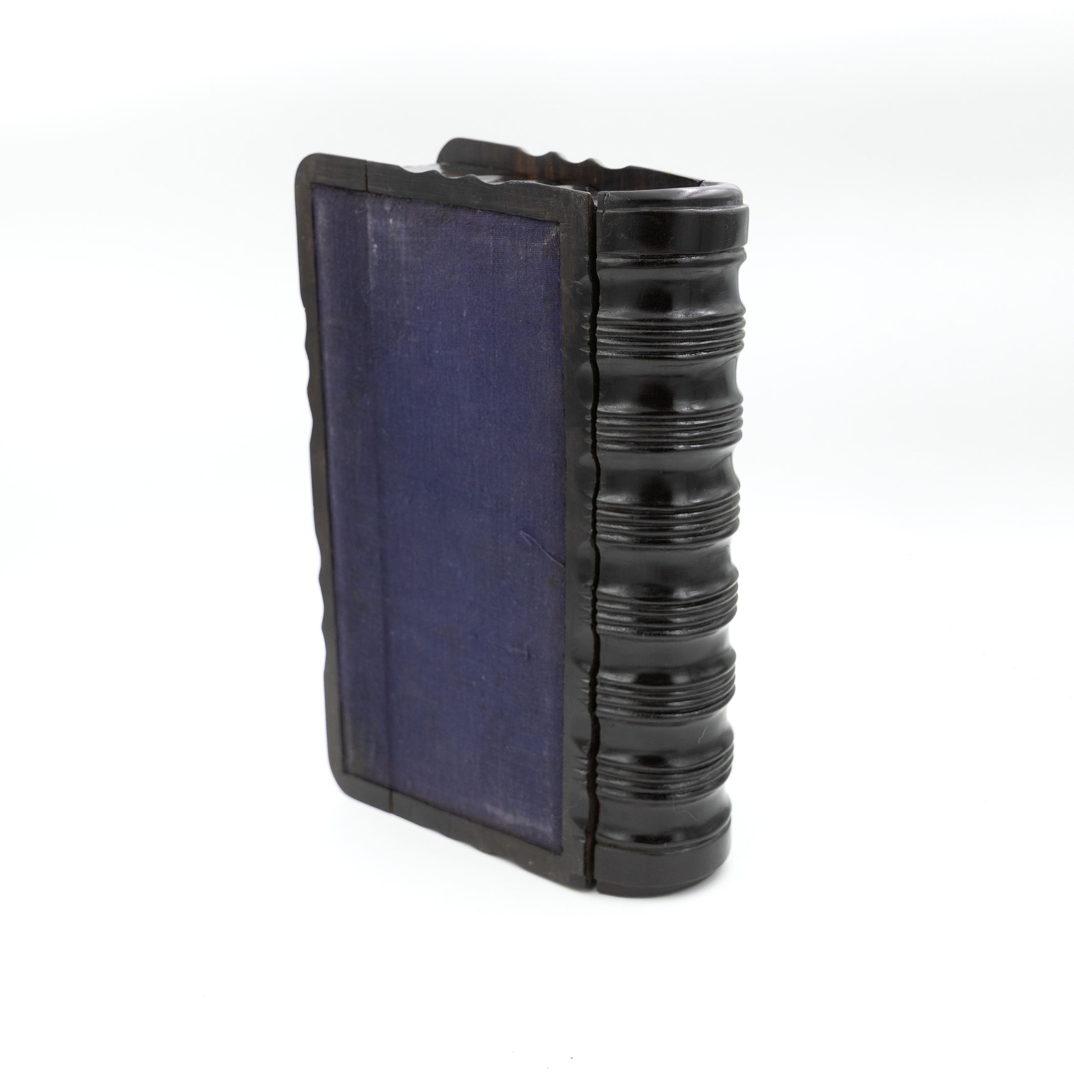 Base of antique wooden box standing upright showing protective lining