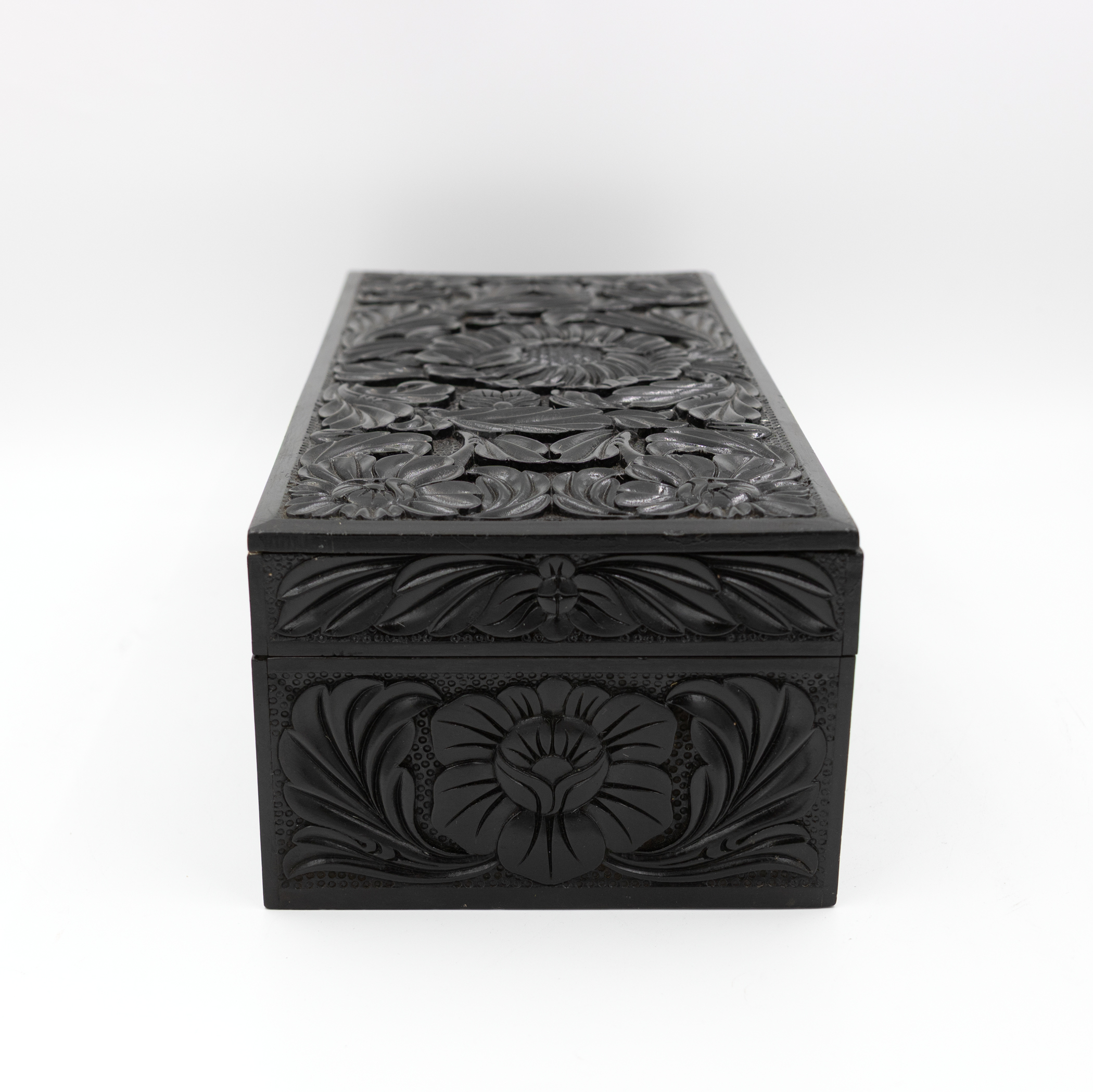 Anglo-Indian ebony box top and front carved floral panels