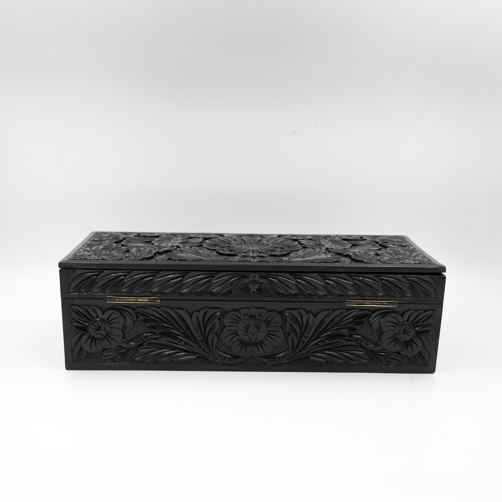 Back of carved ebony glove box.