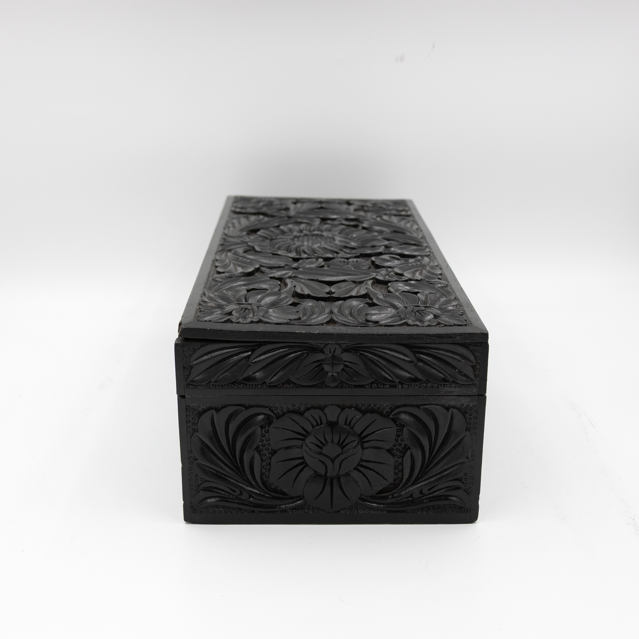 Side profile of antique ebony box.