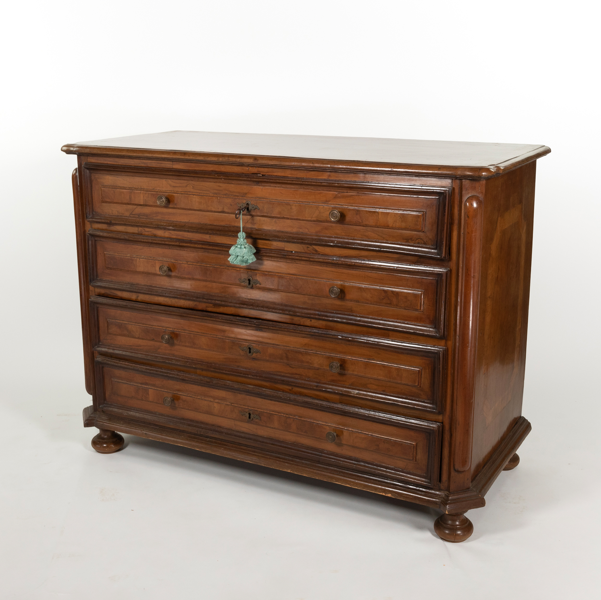Early 18th-century Italian walnut commode, three-quarter view.