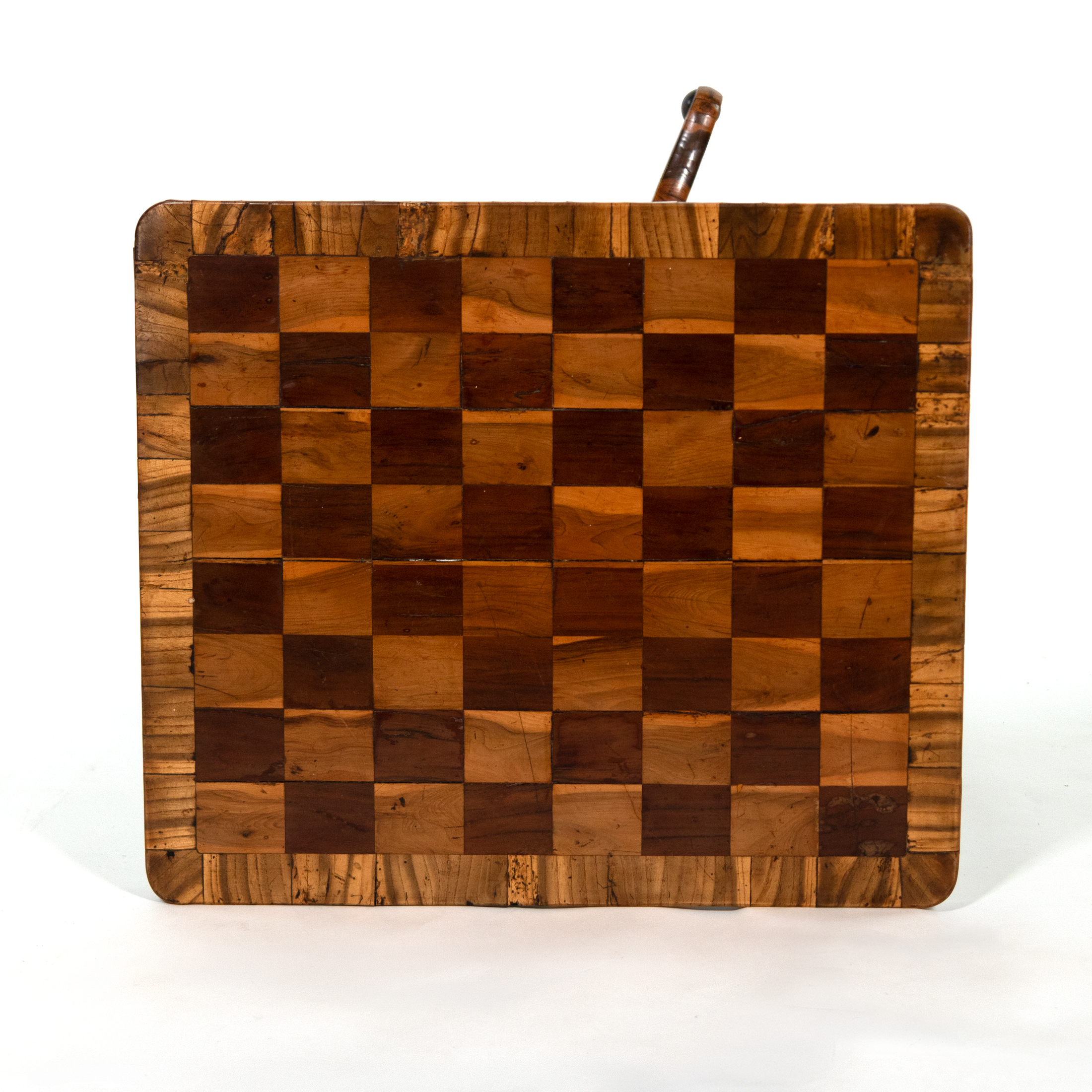 Detail of inset chessboard top with alternating light and dark veneers and surrounding oyster veneer border on Regency games table.