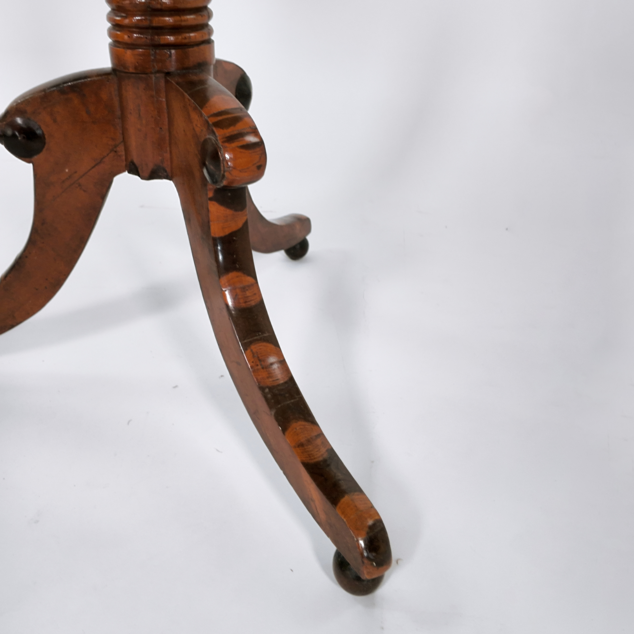 Oyster veneer panels inlaid along the leg of a Regency games table, English circa 1830