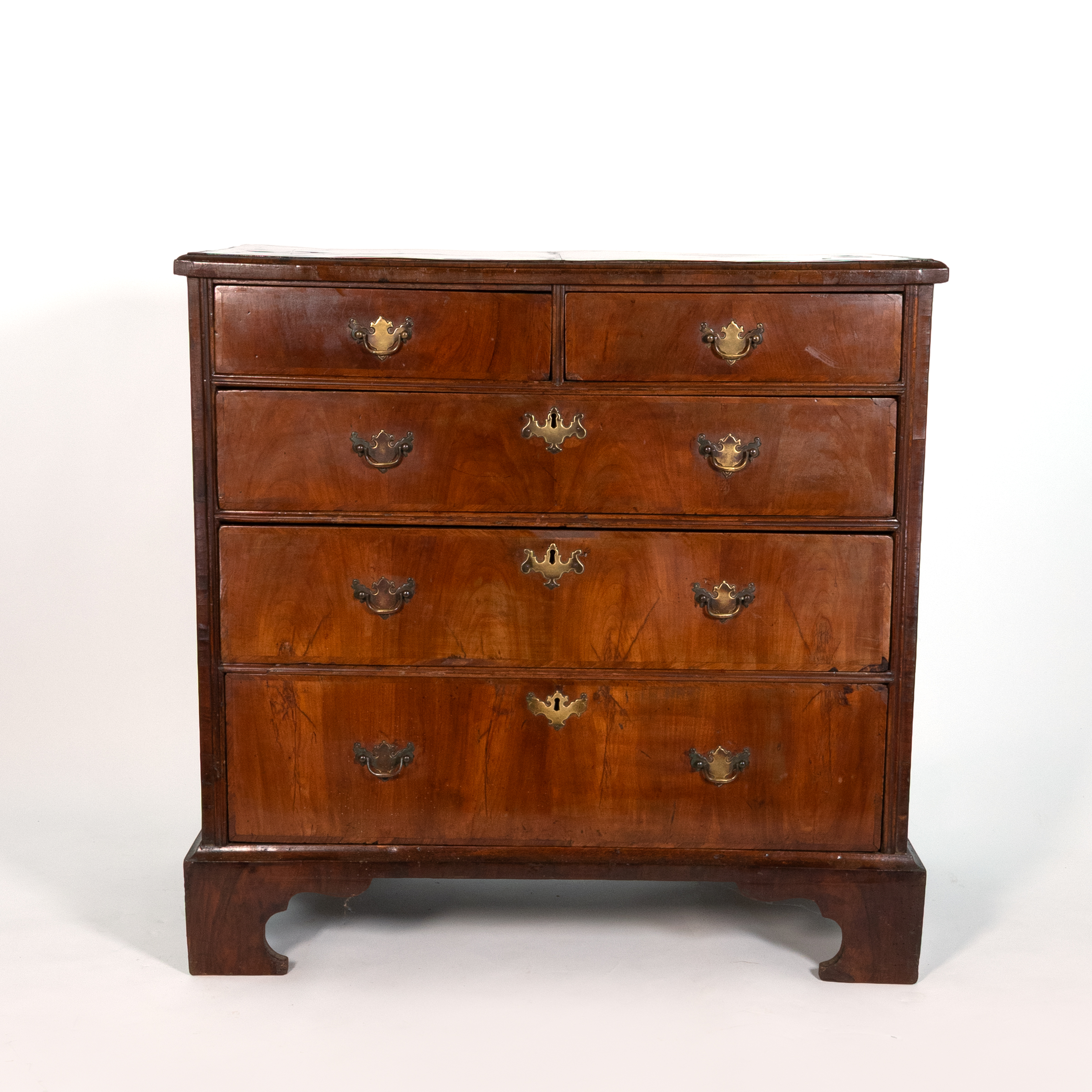 George II walnut chest of drawers, English circa 1720, front elevation with two short and three graduated long drawers, bracket feet and brass bail handles, Garden Court Antiques San Francisco