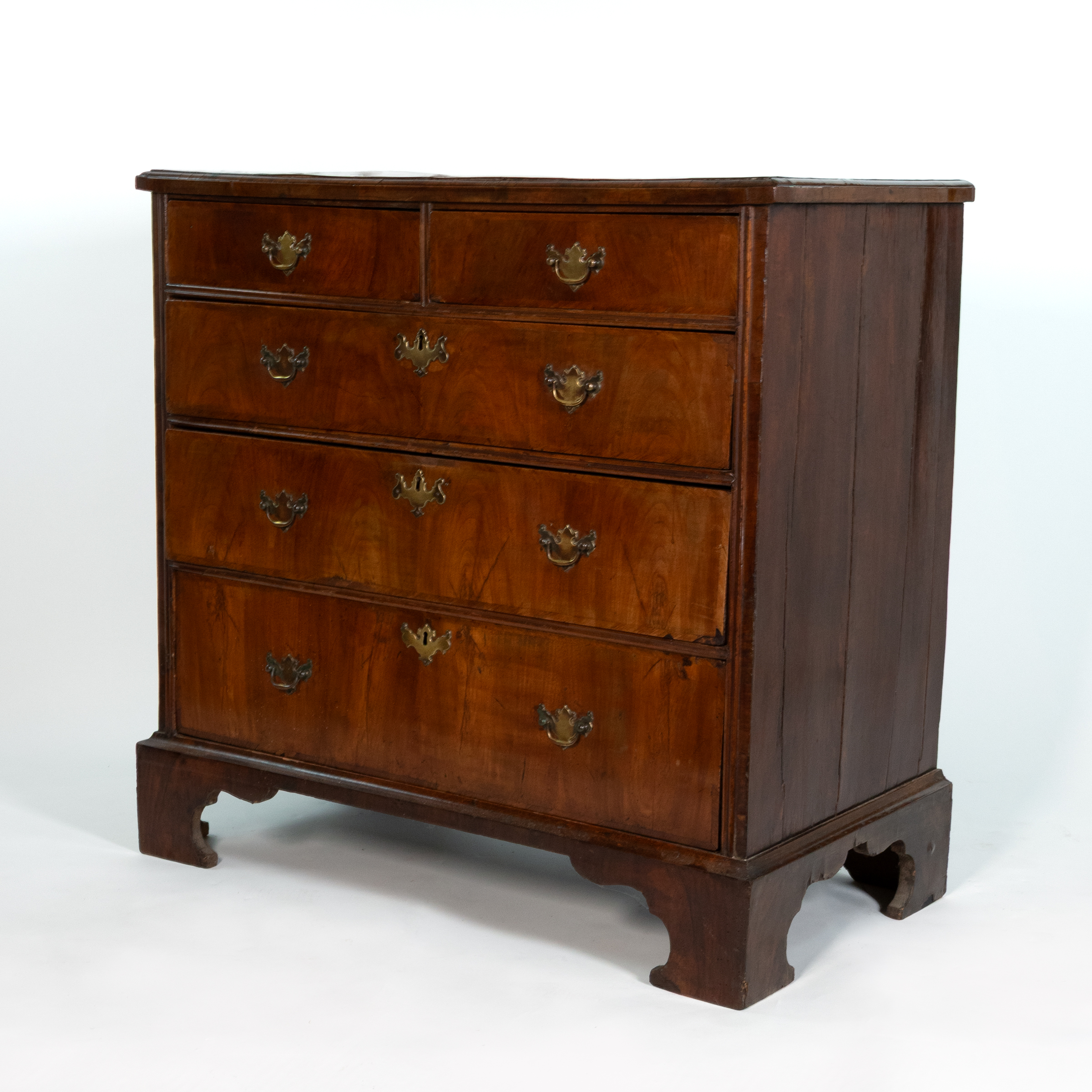 George II walnut chest of drawers, English, circa 1720, left front angle