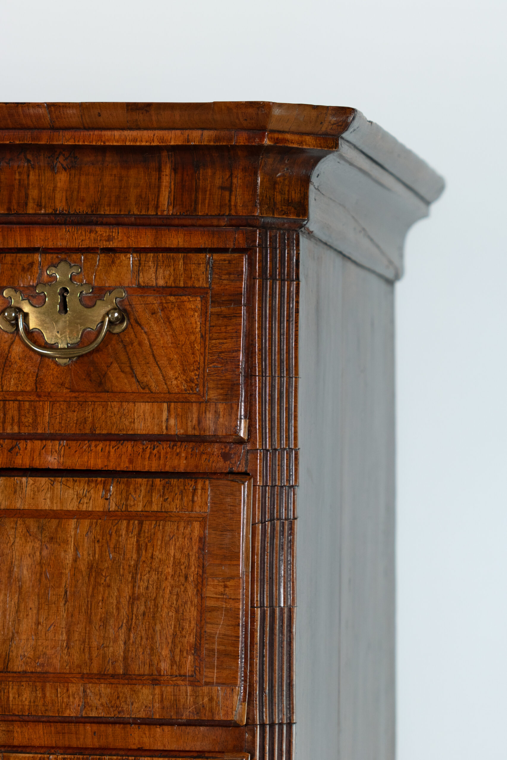 Upper corner cornice and reeded column detail, Georgian walnut chest on chest, circa 1720