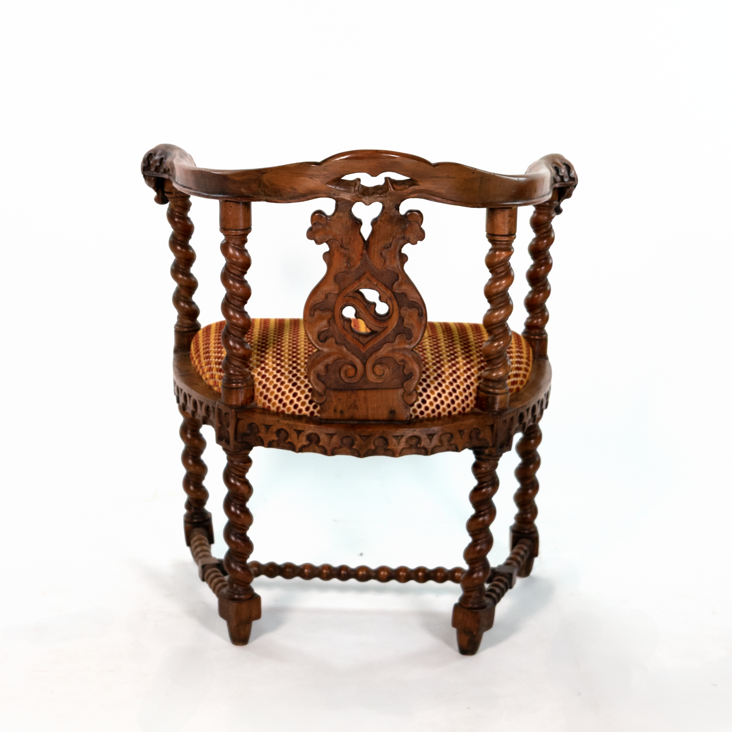 Rear view of English Gothic Revival yew tub chair with pierced carved splat