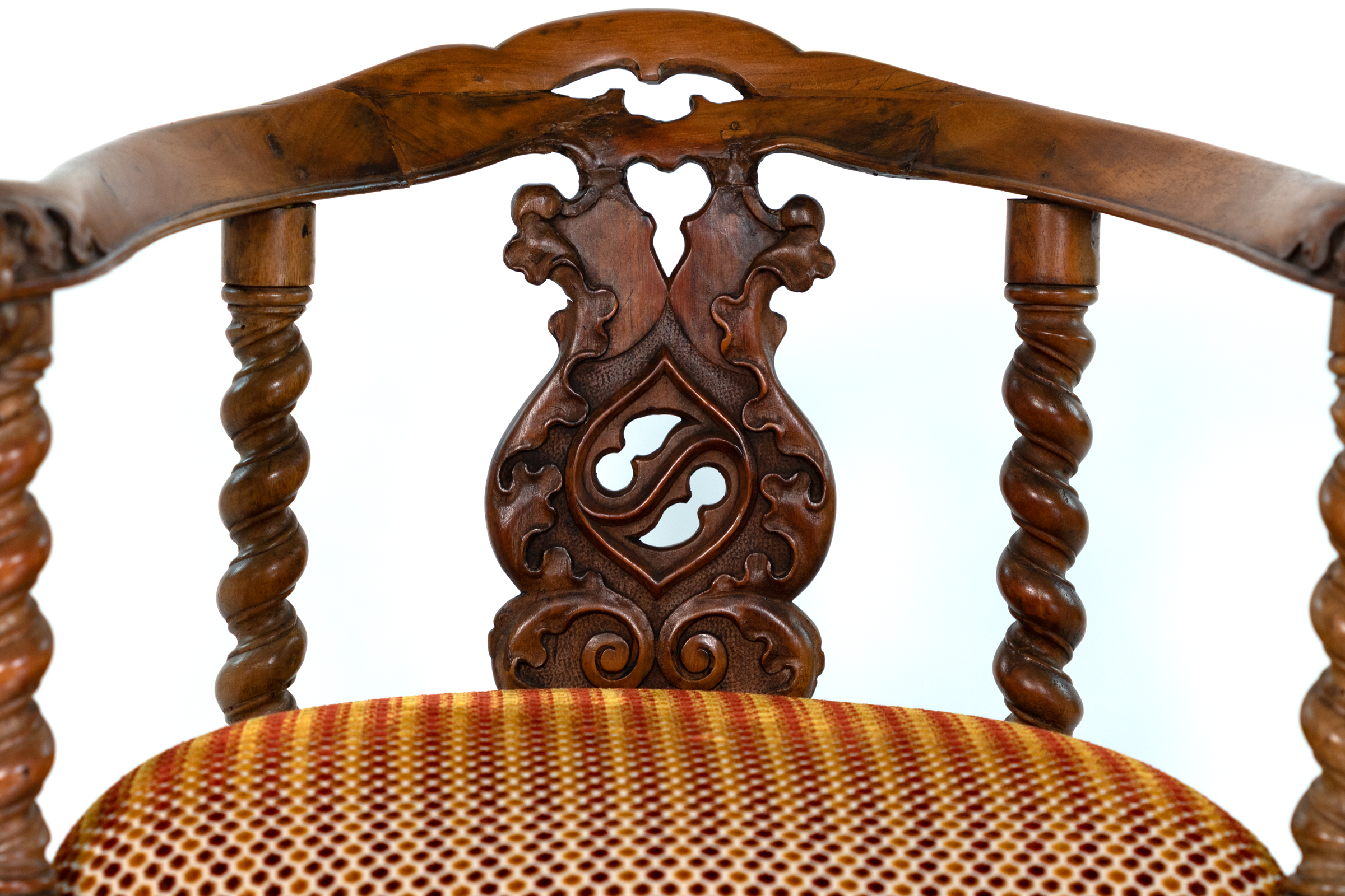 Detail of pierced foliate splat on English Gothic Revival yew tub chair