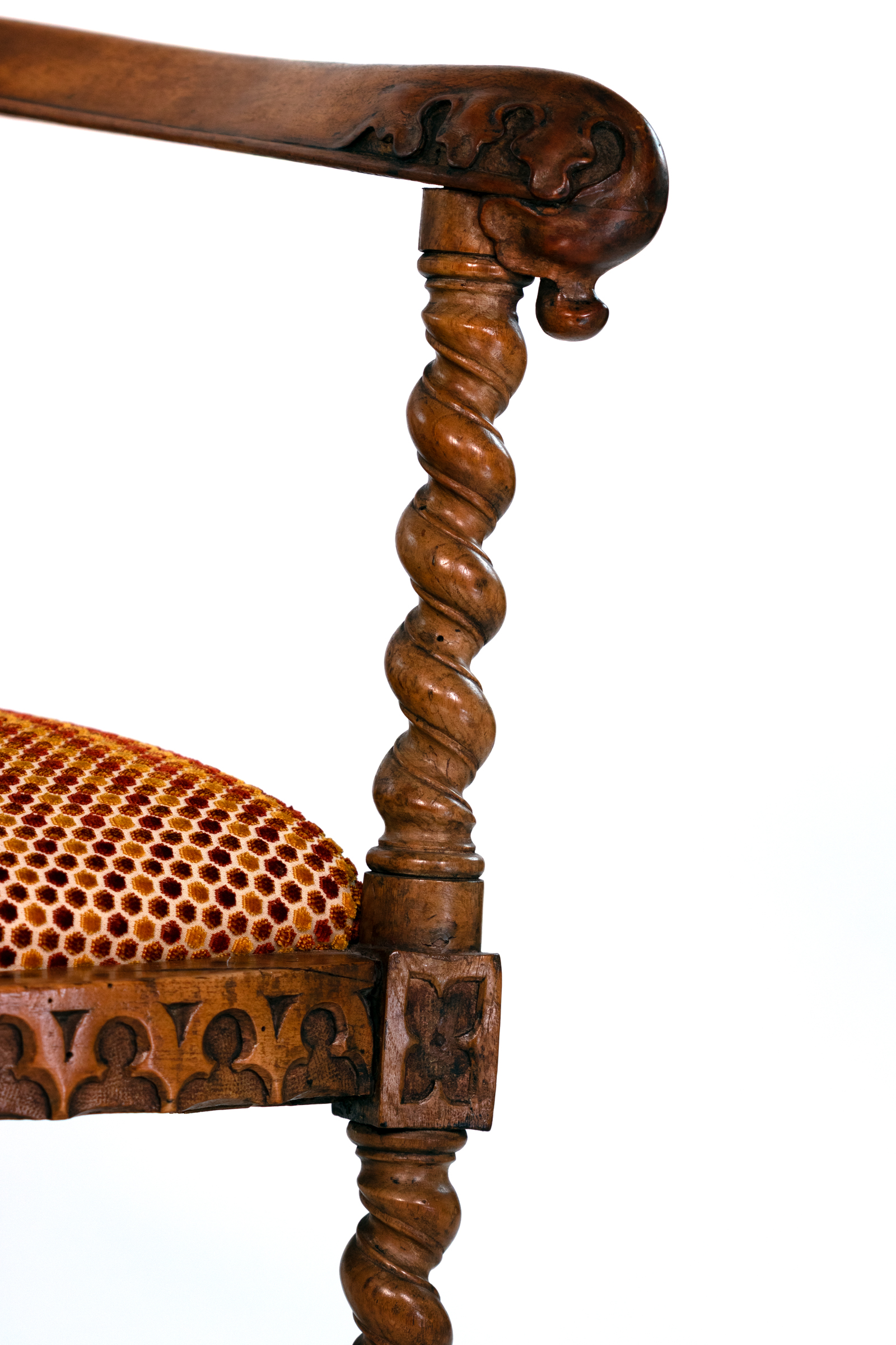 Detail of barley-twist support and Gothic apron on English Gothic Revival yew chair