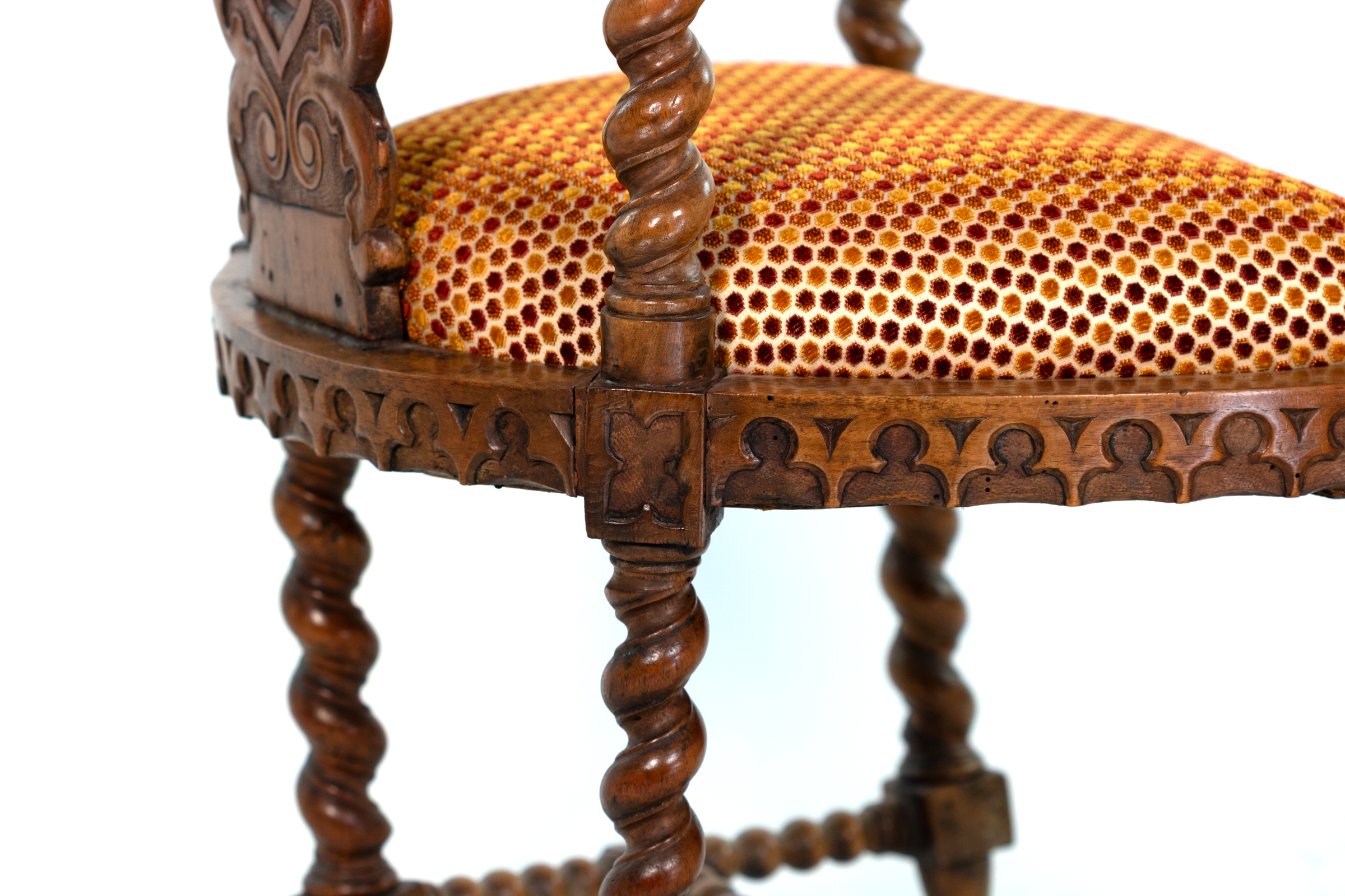 Detail of carved Gothic apron on English Gothic Revival yew tub chair