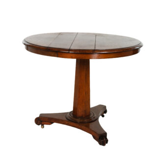 English fruitwood center table, circa 1850, with round top, octagonal pedestal and tripod base on castors