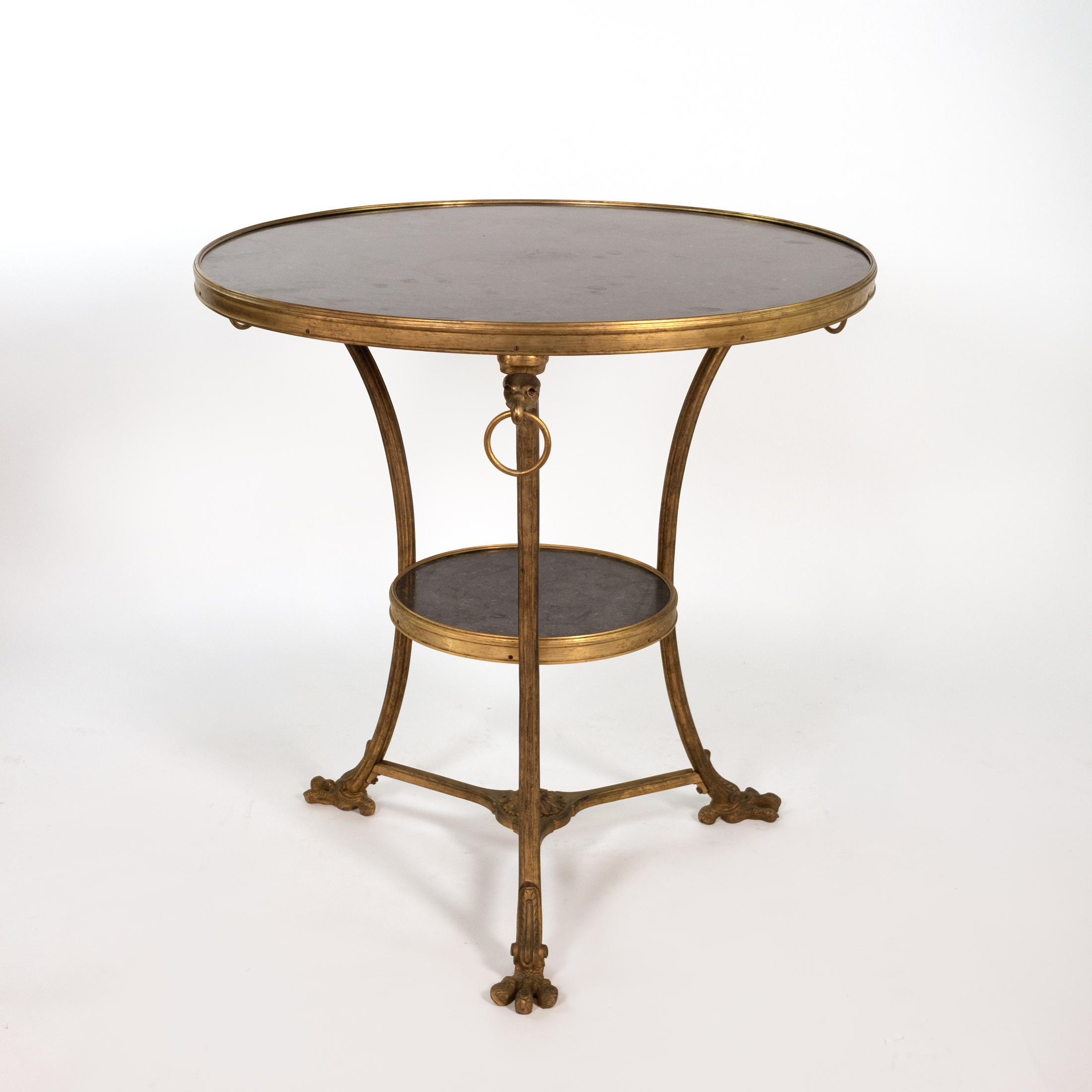 French gilt-bronze two-tier gueridon with black fossil marble top and lower tier, circa 1880