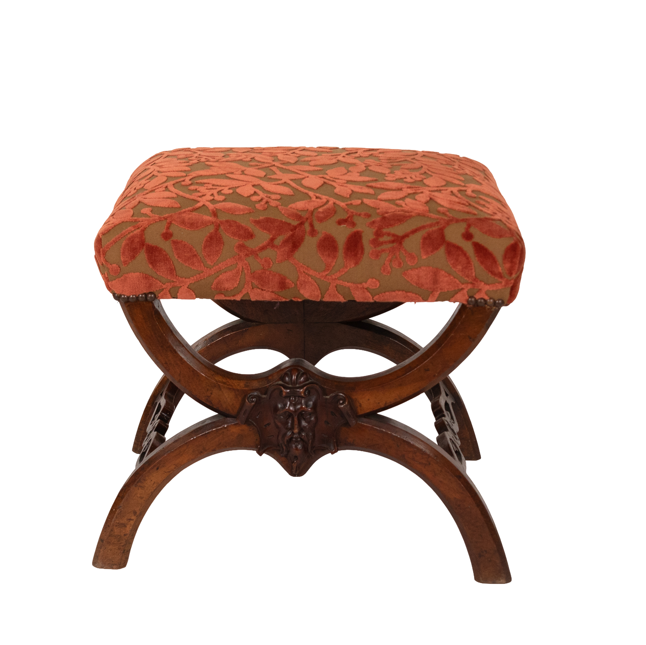 Carved walnut curule-form stool, French circa 1830, front view with cut velvet seat and carved mask