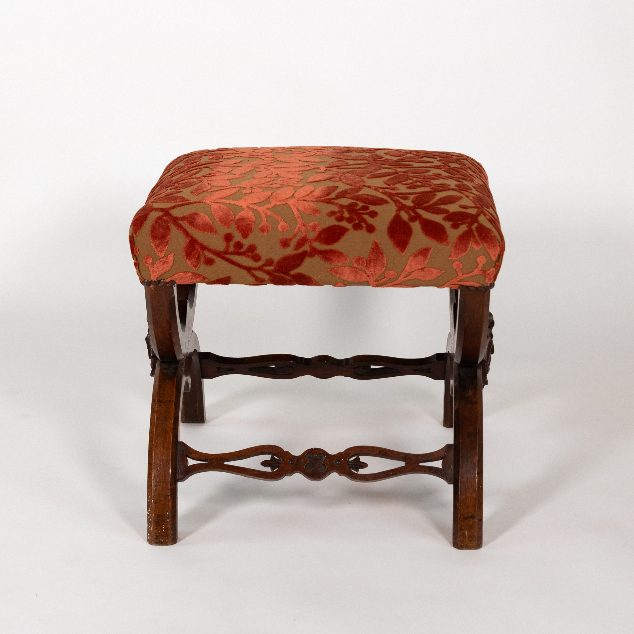 Walnut curule-form stool side view, pierced stretcher and flattened feet, French circa 1830