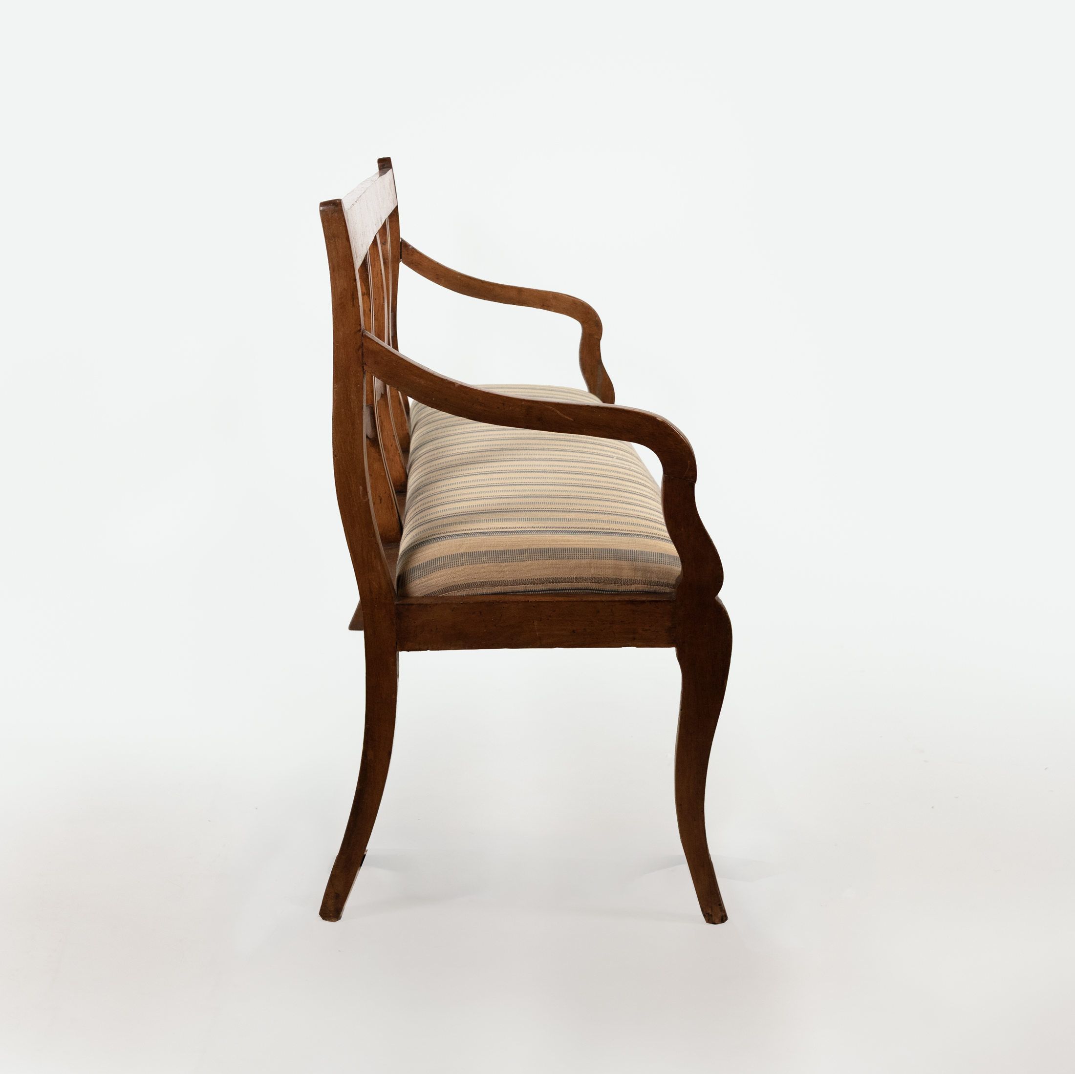 Opposite side profile of Italian walnut bench circa 1880 with curved arm and upholstered drop-in seat