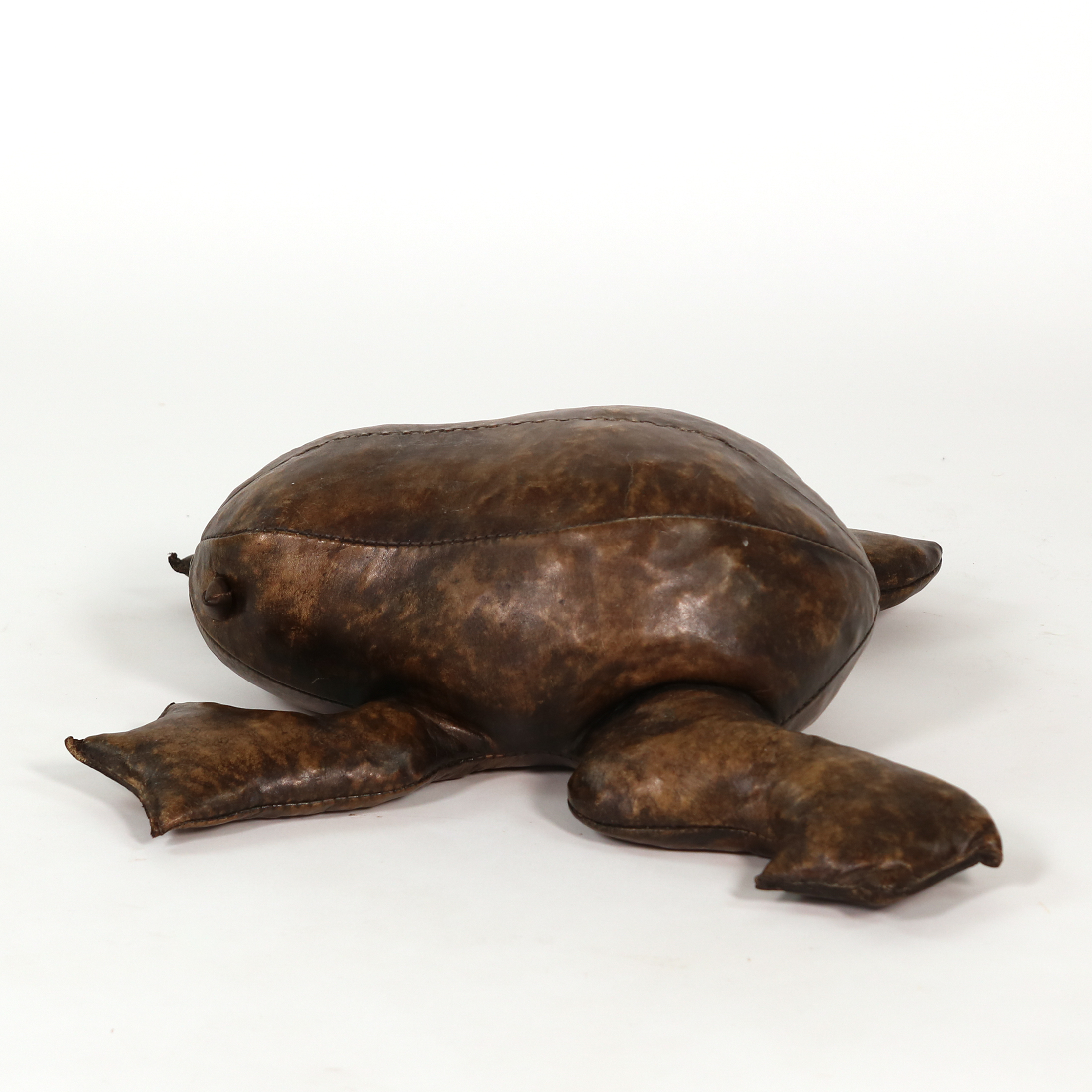 Side view of leather frog footstool in the manner of Dimitri Omersa with splayed webbed feet