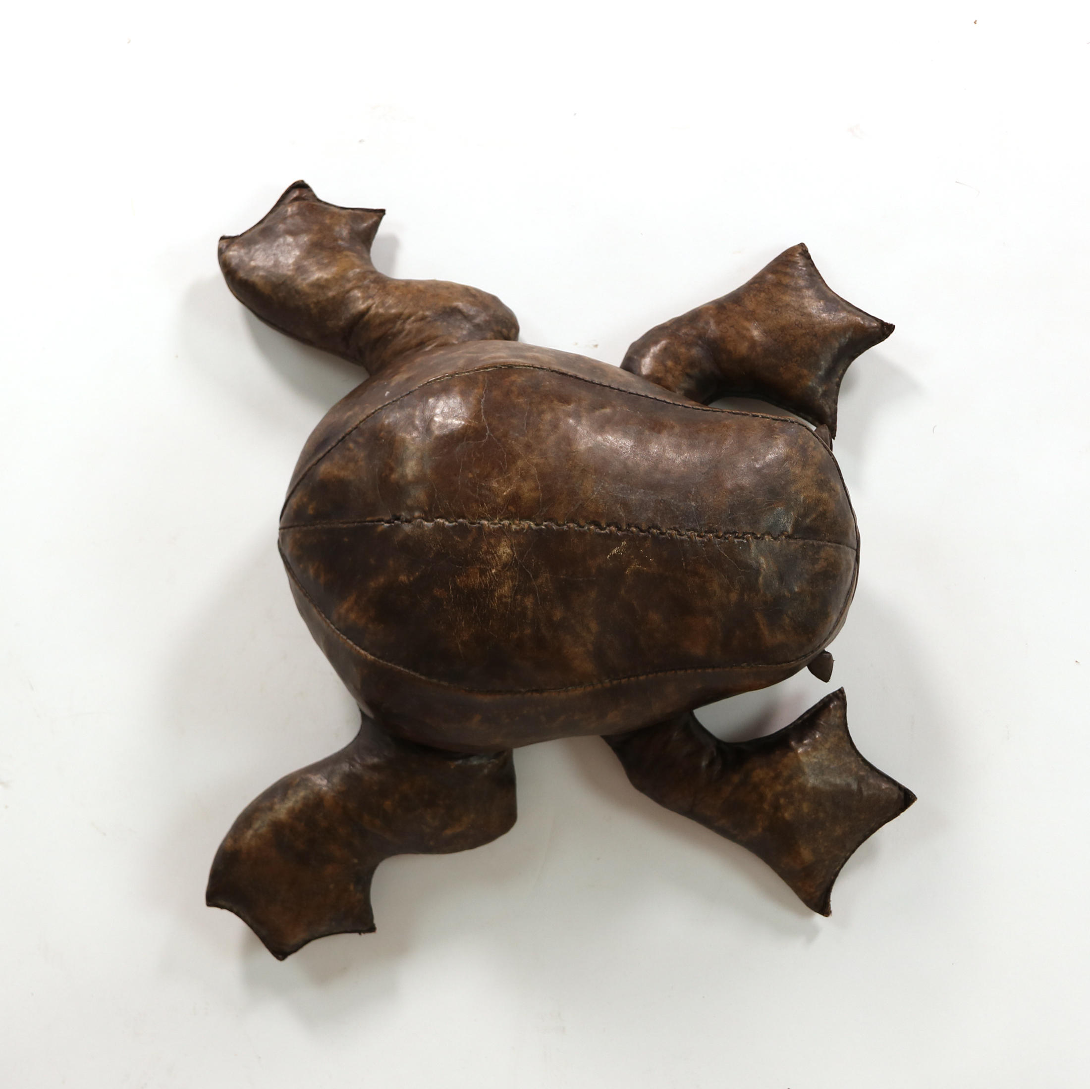 Overhead view of leather frog footstool in the manner of Dimitri Omersa showing stitched back and webbed feet