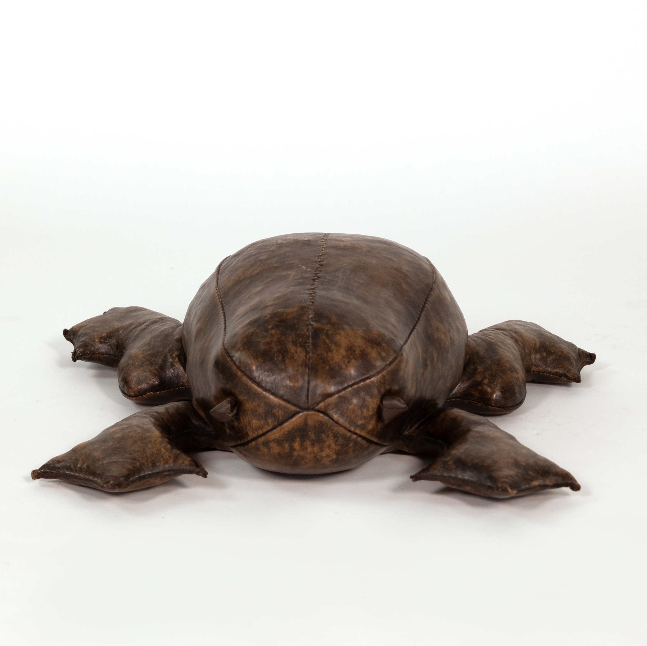 Front view of leather frog footstool in the manner of Dimitri Omersa with knotted eyes and webbed feet