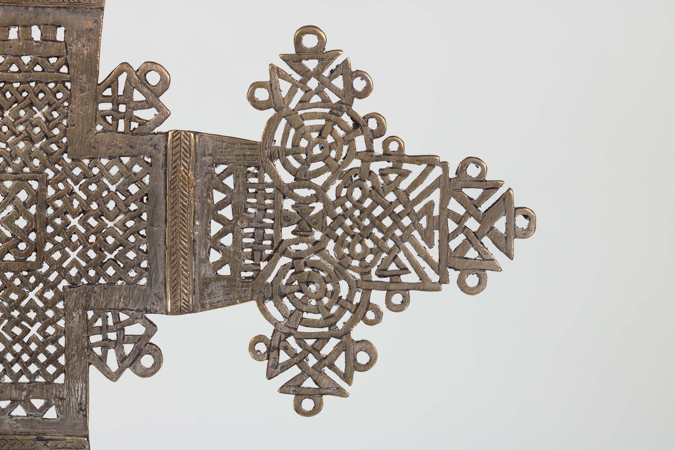 Detail of Ethiopian brass processional cross arm terminal with concentric roundels and interlace