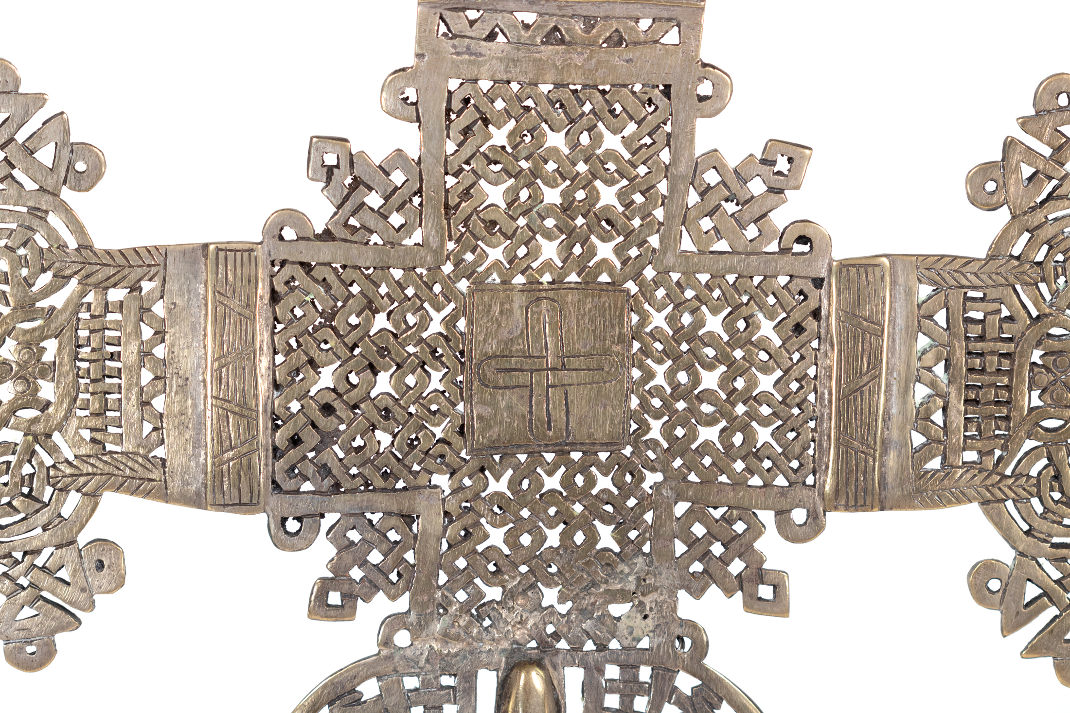 Detail of Ethiopian processional cross central plaque incised with a looped cross in brass