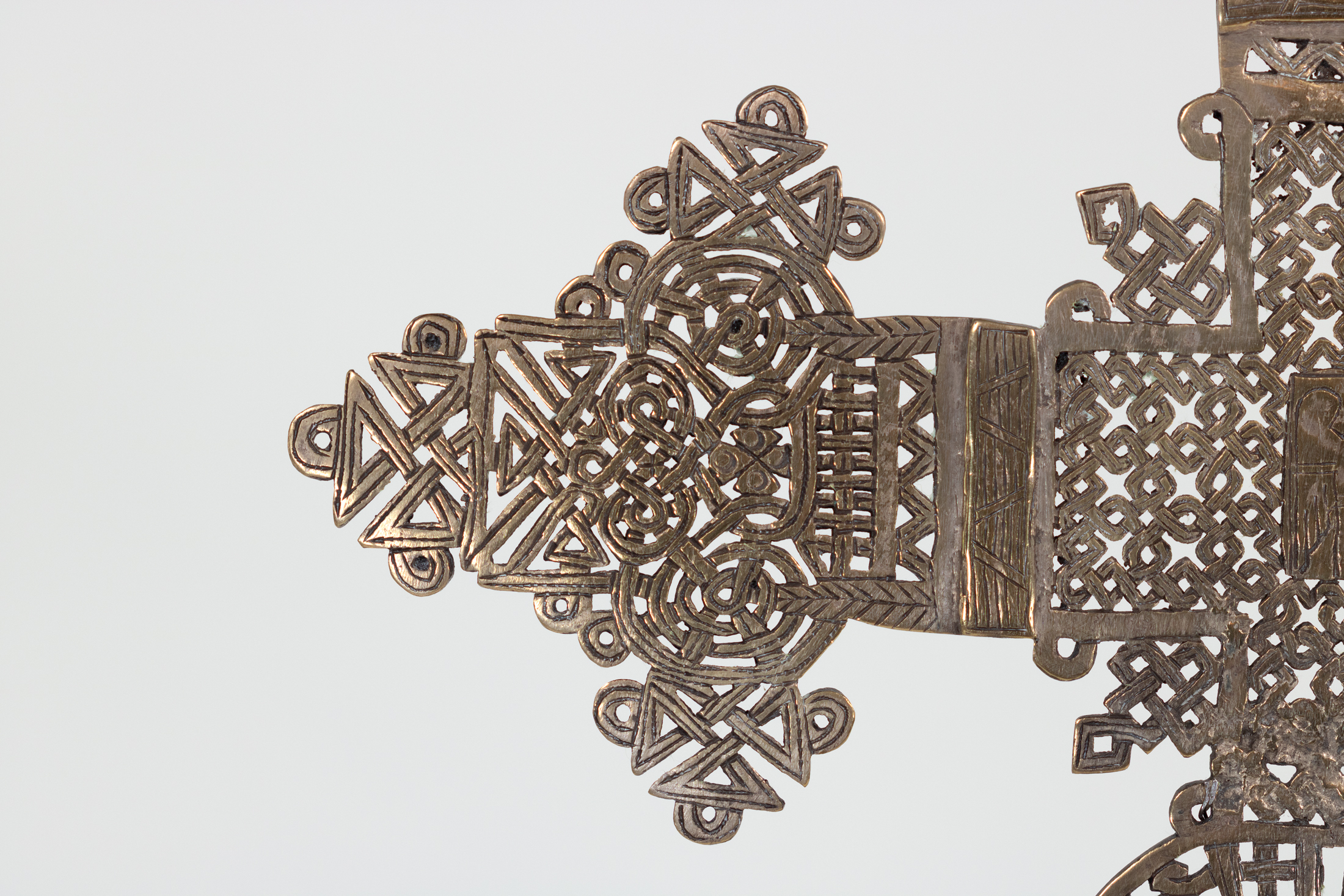 Detail of smaller Ethiopian processional cross left arm terminal with interlace and roundels